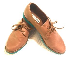 Tan loafers with teal sole